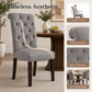 Rustic Upholstered Dining Chair with Button-Tufted Scroll Back