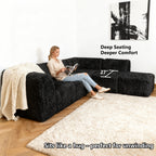 Black Sofa with One Arm and Chaise Extension showcases its deep seating design– a lady comfortably enjoys reading time on the sofa