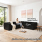 Black Sofa with Dual Arms showcases its deep seating design– a lady comfortably enjoys reading time on the sofa
