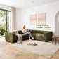 Olive green Sofa with Dual Arms showcases its deep seating design– a lady comfortably enjoys reading time on the sofa