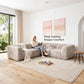 Taupe gray Sofa with Dual Arms showcases its deep seating design– a lady comfortably enjoys reading time on the sofa