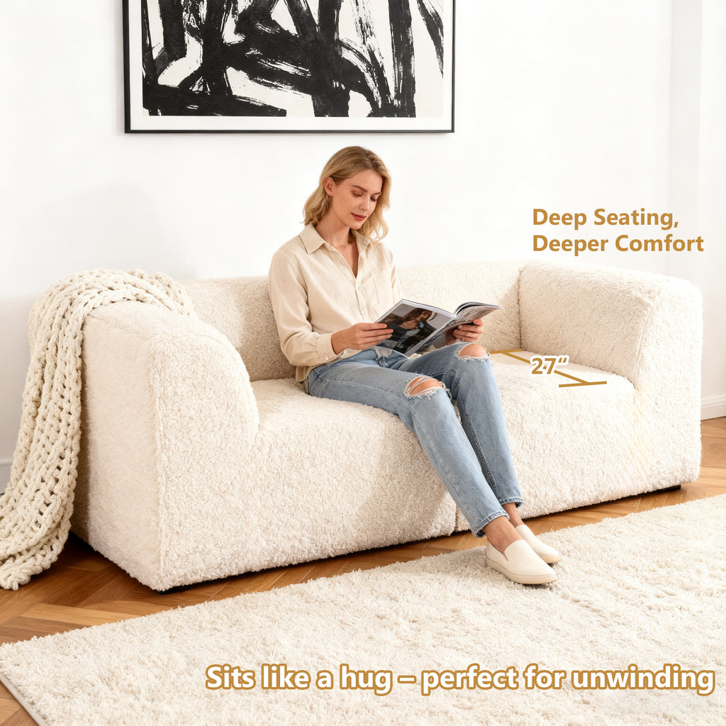 Soft sand Modular Loveseat showcases its deep seating design– a lady comfortably enjoys reading time on the sofa