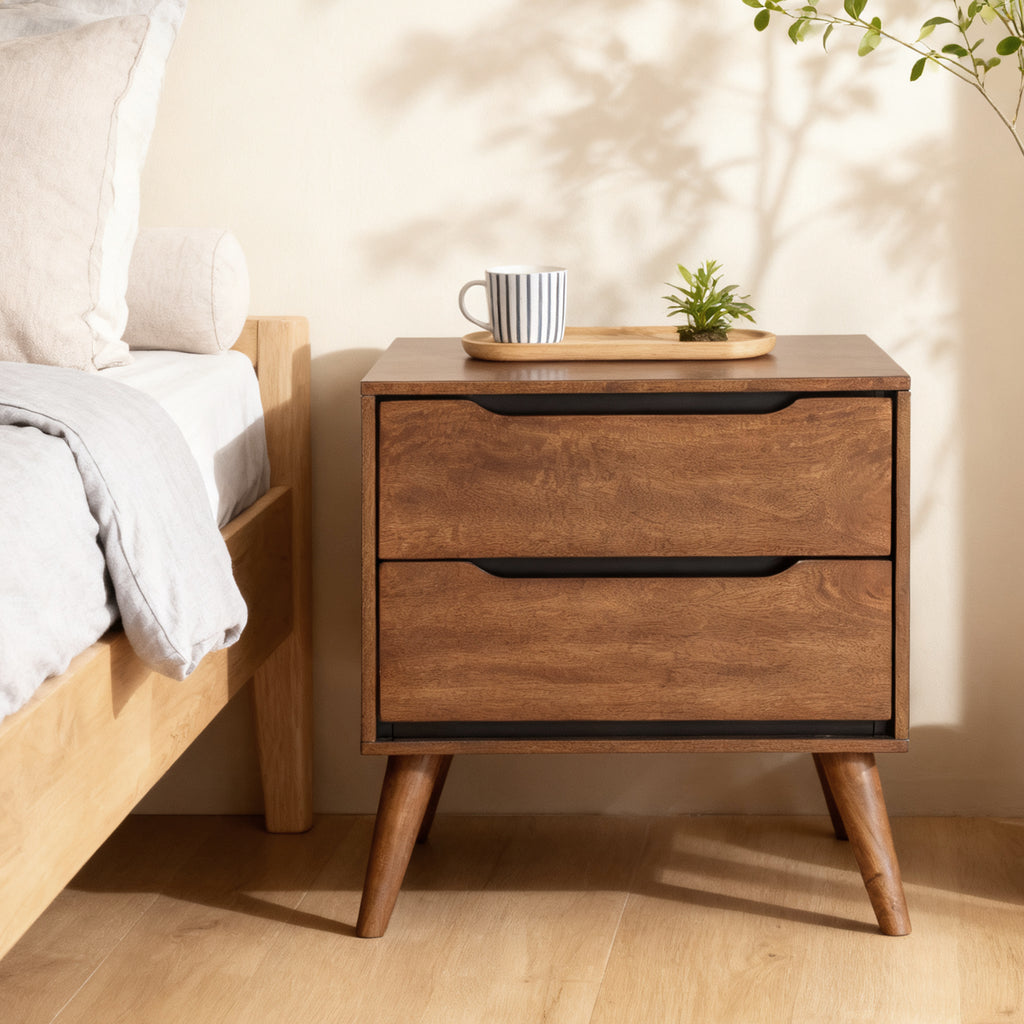 Images of a bedside scene in an oak-colored modern wooden nightstand.